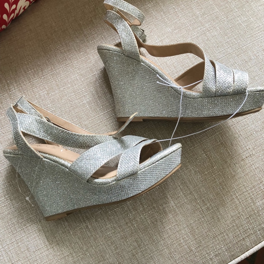 Wedge Heels. After five or business casual. Ripped when removing the price
